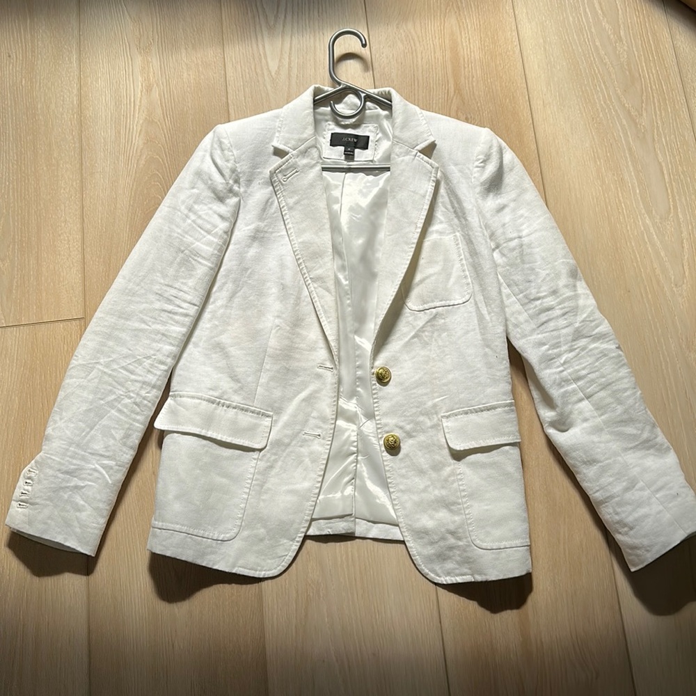 . Small makeup stain on back left arm that will come out w/ cleaning